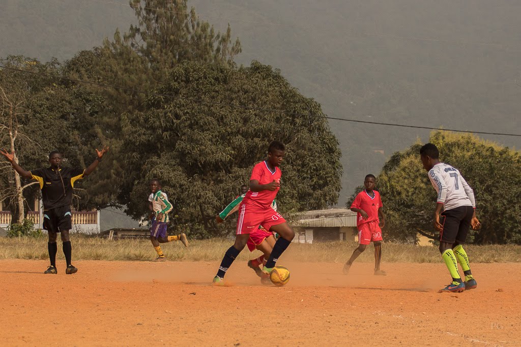 A young football player practising ball control during a training drill